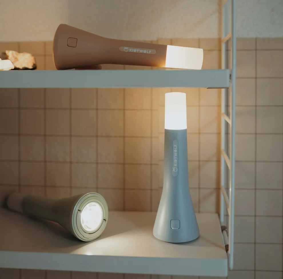 Adventure Awaits Kidywolf portable LED flashlights and night lights displayed glowing on shelving