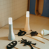 Adventure Awaits portable LED night lights with glowing tops beside shadow puppet cut-outs on a tabletop