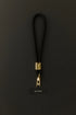 Black Klipsta phone wrist strap with gold clasp and phone connector tab, Adventure Awaits
