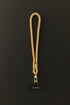 Tan Klipsta phone wrist strap with gold clasp and phone connector tab, Adventure Awaits