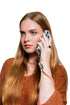 Woman takes a call with her phone secured by a tan wrist strap, Adventure Awaits