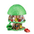 Toy treehouse with a green roof and wooden base, featuring small furniture and a red car on a white background.