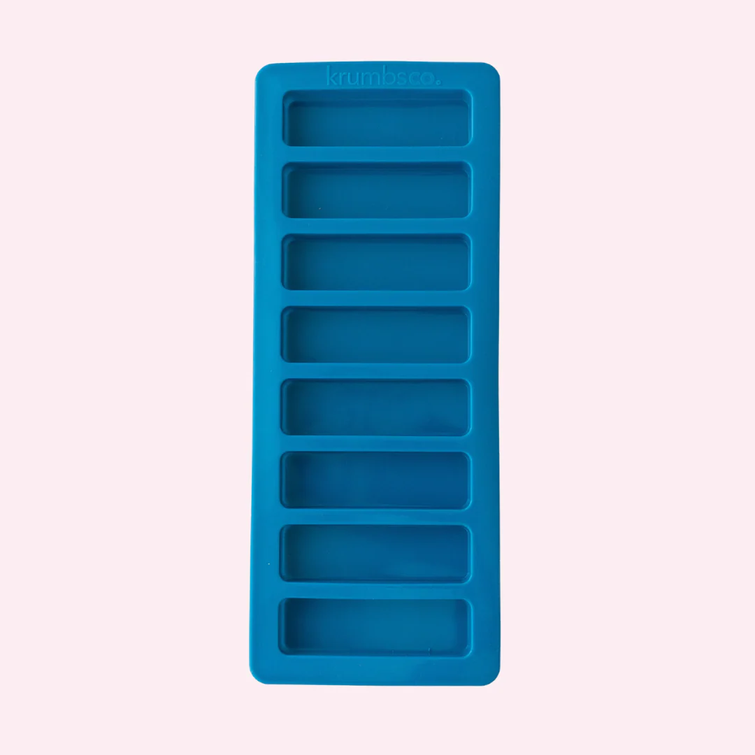 Blue muesli tray with multiple rectangular compartments on a light purple background