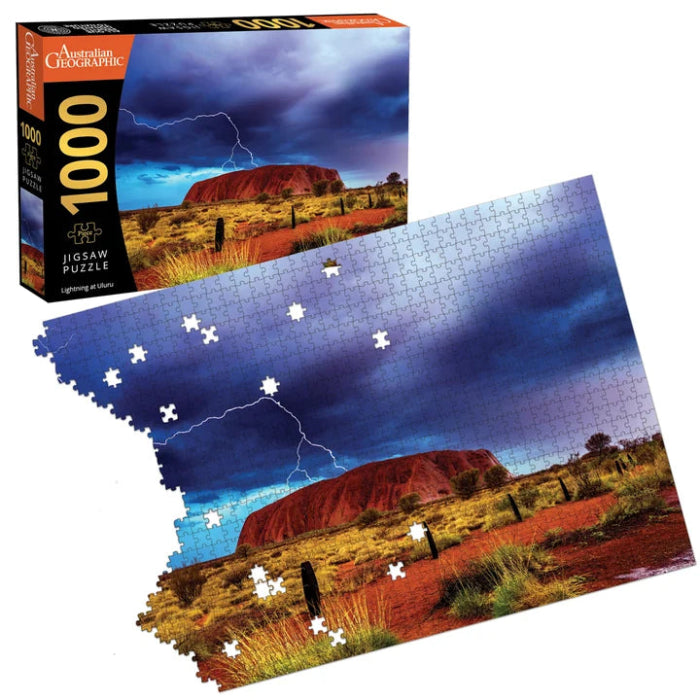 Partially completed Australian Geographic Lightning at Uluru 1000-piece jigsaw beside its box — Adventure Awaits