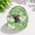 Clear green squishy sensory toy with grey koala suspended inside in sunlight — Adventure Awaits