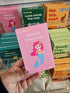 Adventure Awaits Little Genius Mermaid snap cards box held in store with colourful kids game displays behind