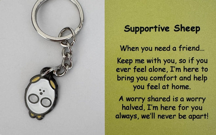 Supportive Sheep keyring with white comfort charm and support card close-up — Adventure Awaits