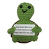 handmade crochet turtle plush toy holding a “Low Social Battery” sign about reaching the people limit for the day
