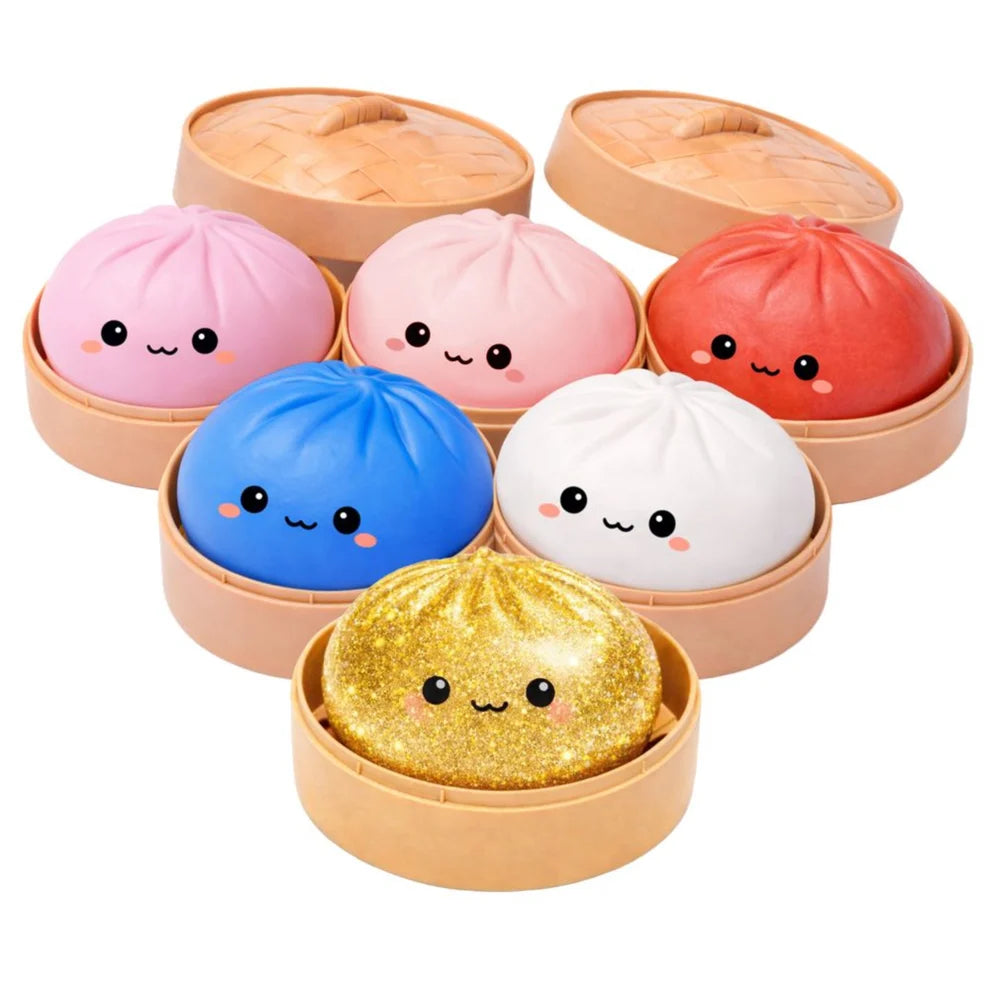 Set of colourful Lucky Bao bun-shaped squishies with faces in a steamer-like container on a white background
