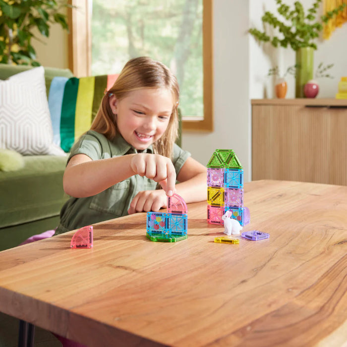 Child building Magna-Tiles microMAGS Spring Garden houses with bunny figure — Adventure Awaits
