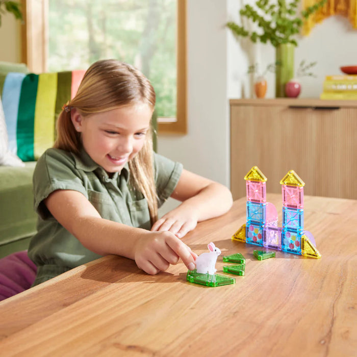 Child playing with Magna-Tiles microMAGS Spring Garden set and bunny figure — Adventure Awaits