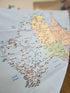 Map of Australia with labeled states and roads on a textured surface.