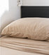 Beige caravan bunk bed pillow and bedding in a minimalist modern camper sleeping space