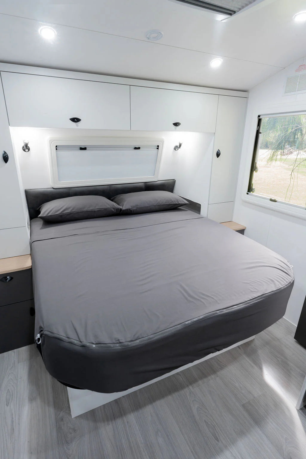 MeanderWild charcoal flannelette sheet set on a queen caravan bed — soft and warm for Aussie winters on the road — Adventure Awaits