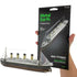 Hand holds Metal Earth RMS Titanic steel model kit beside the assembled ship - Adventure Awaits