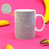 White ceramic mug with black micro penis pattern on a bright pink background — Adventure Awaits