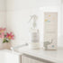 Mindful and Co calming magnesium oil spray bottle with packaging on bathroom counter, gentle sleep support for babies and children at home or travel Adventure Awaits