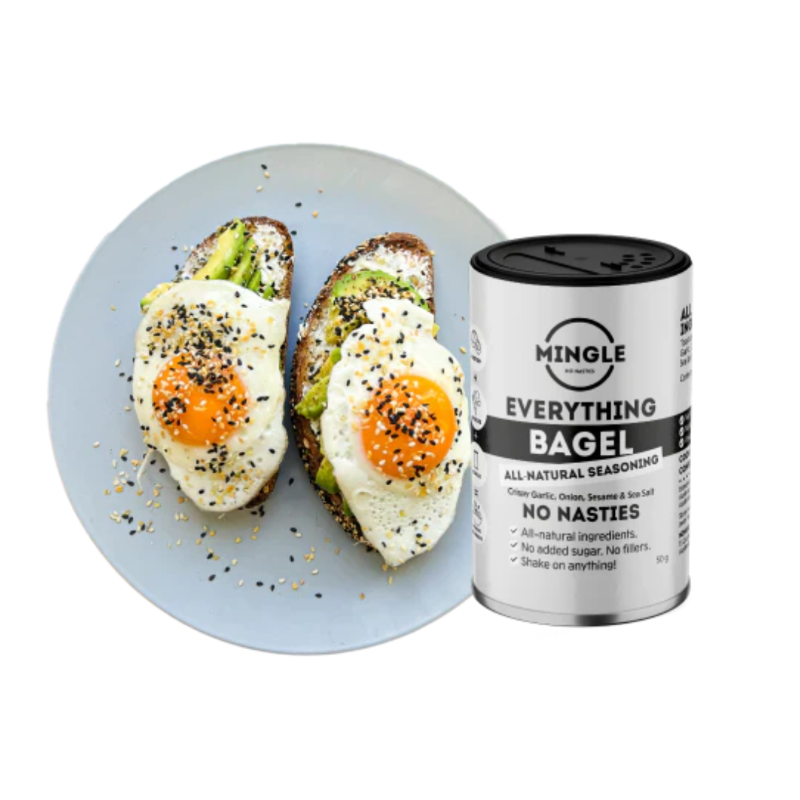 Mingle Everything Bagel seasoning tin beside avocado toast with fried eggs — Adventure Awaits