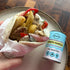 Greek pita wrap with chicken, chips and garlic sauce beside Mingle Greek Garlic seasoning, easy meal idea Adventure Awaits
