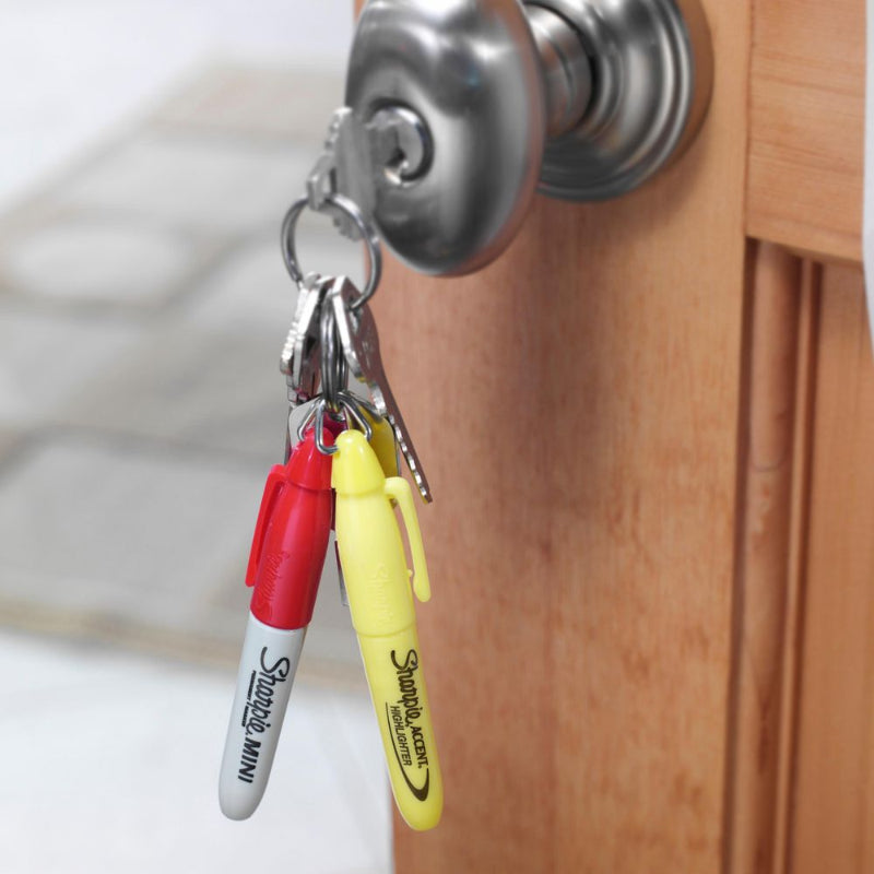 Red and yellow Sharpie Mini permanent markers attached to a keyring in a door lock — Adventure Awaits