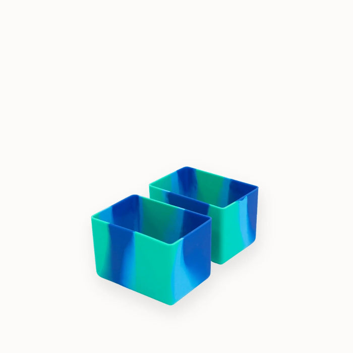 Two blue and teal marbled bento lunchbox divider cups on a plain background — Adventure Awaits