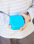 Child holding a blue Montiico snack container with fitted lid — Adventure Awaits