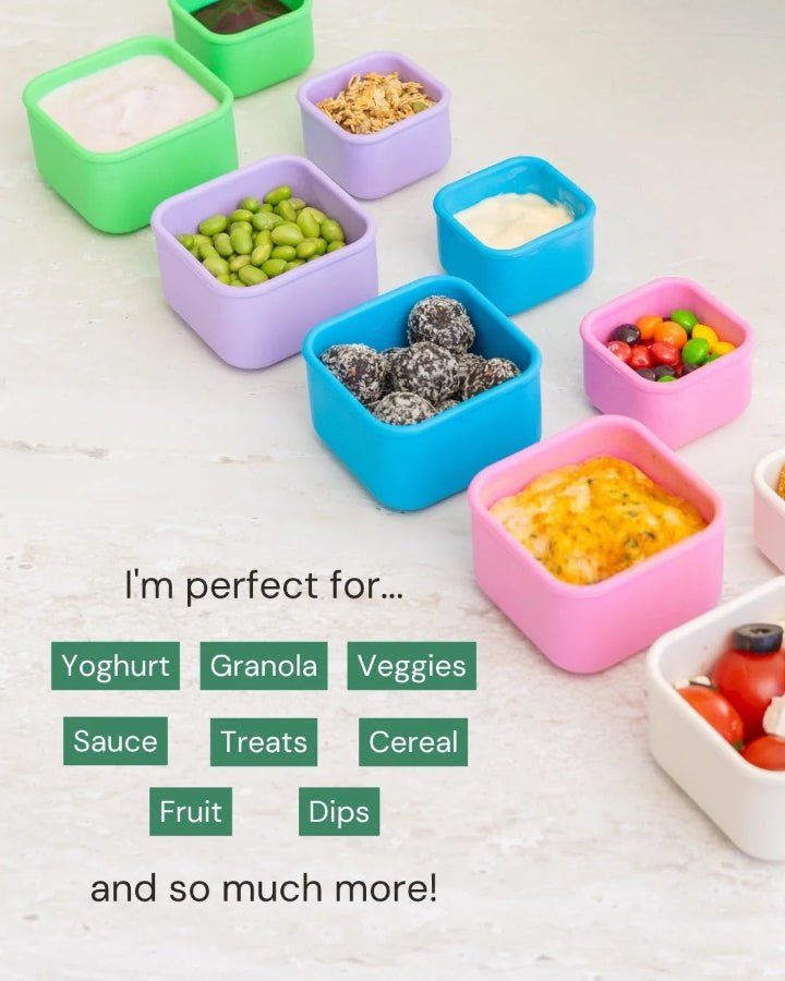 Colourful Montii snack containers filled with yoghurt, fruit, veggies, dips and treats — Adventure Awaits
