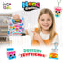 smiling child holding Craft for Kids Nano Creations Squishy Keyfriends kit with colourful DIY inflatable keychain squishy characters including fish and drink designs Adventure Awaits