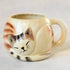 Cream ceramic cat mug shaped like a curled sleeping tabby — Adventure Awaits