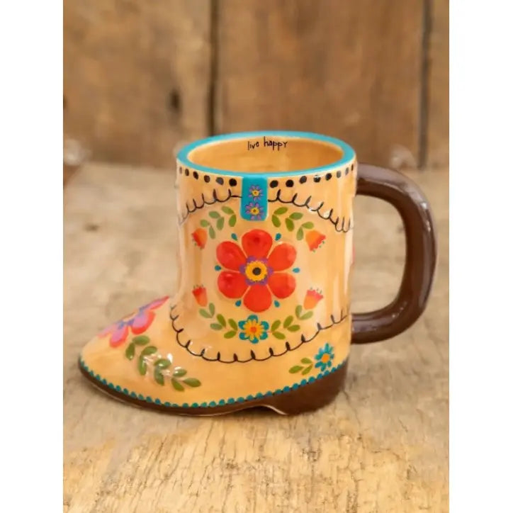 Decorative cowboy boot shaped ceramic mug with colourful floral artwork and “live happy” message