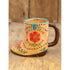 Decorative cowboy boot shaped ceramic mug with colourful floral artwork and “live happy” message