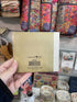 Back of It’s the Little Things happy notes booklet in colourful gift shop display — Adventure Awaits