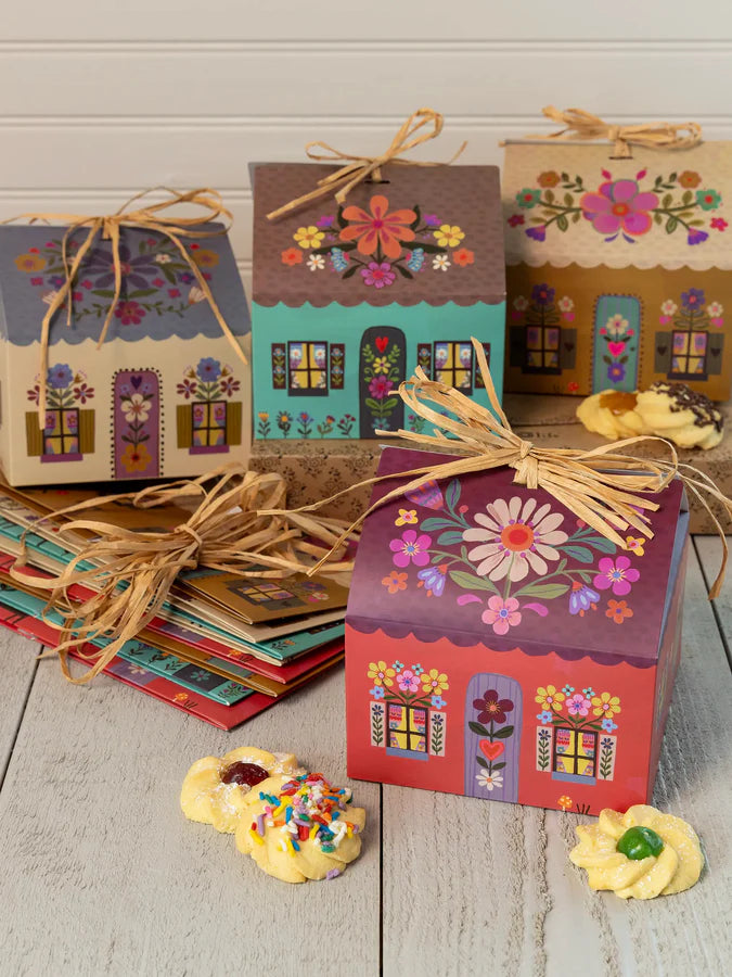 Floral cottage gift boxes with ribbon on table with biscuits, colourful gift packaging for hampers