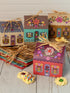Floral cottage gift boxes with ribbon on table with biscuits, colourful gift packaging for hampers