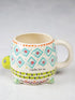 Turtle shaped ceramic mug with colourful geometric patterns and “I turtley love you” quote