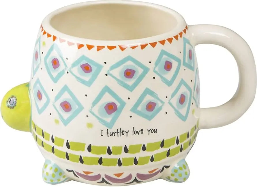 Turtle shaped ceramic mug with colourful geometric patterns and “I turtley love you” message