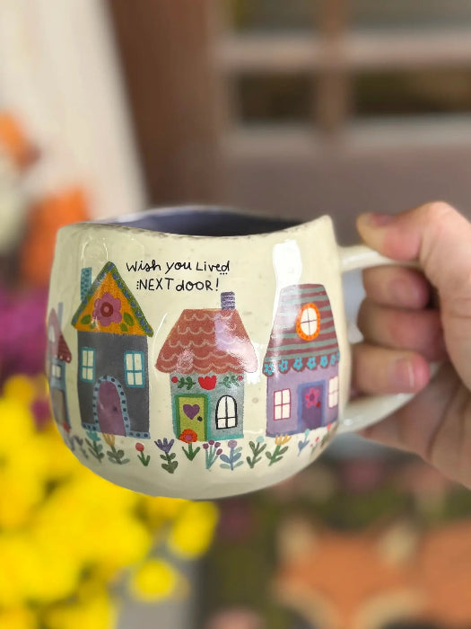 Hand holding "Wish You Lived Next Door" ceramic mug — a sweet gift for a best friend or neighbour — Adventure Awaits