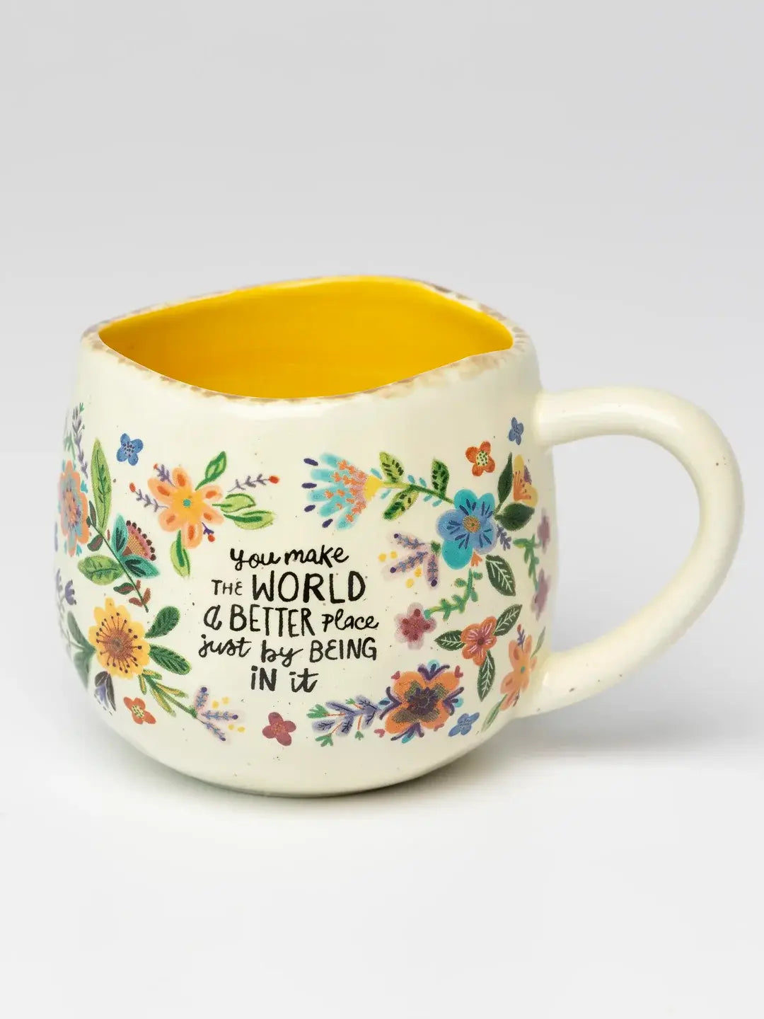 Natural Life floral ceramic mug with yellow interior and “You make the world a better place” quote — Adventure Awaits