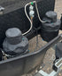 Two grey Navigator Gas Bottle Buddy covers fitted to caravan gas bottles with hoses connected - Adventure Awaits