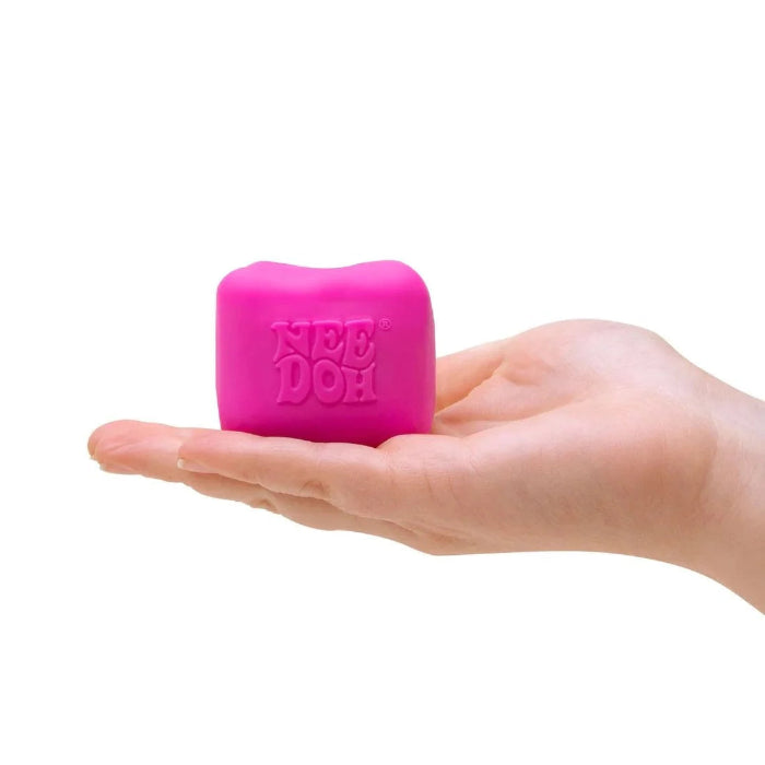 Pink NeeDoh Colour Change Cube in hand on white background, Adventure Awaits
