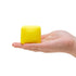 Yellow NeeDoh Colour Change Cube in hand on white background, Adventure Awaits