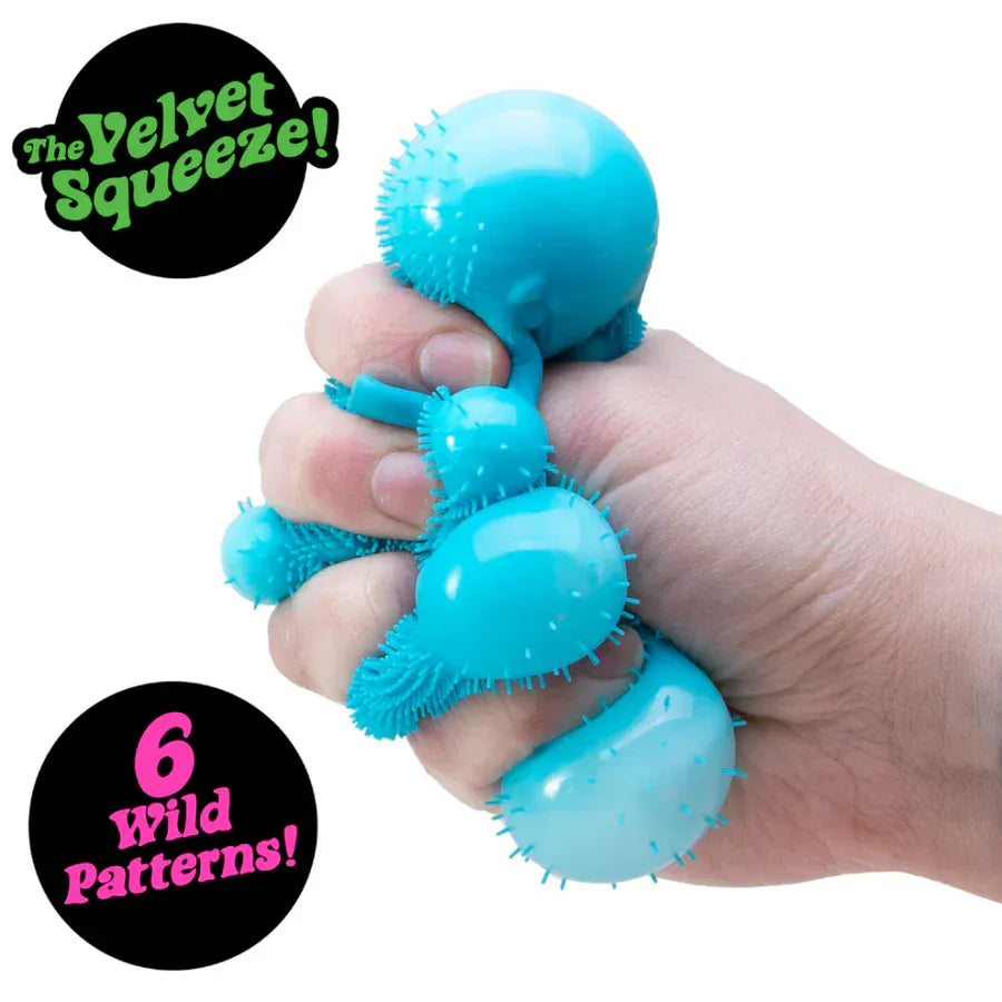 Blue 'Velvet Squeeze' product held in a hand with promotional text on a white background