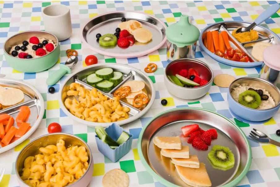 Nestling baby feeding range with stainless steel plates, bowls and colourful tableware — Adventure Awaits