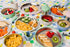 Nestling baby feeding range with stainless steel plates, bowls and colourful tableware — Adventure Awaits