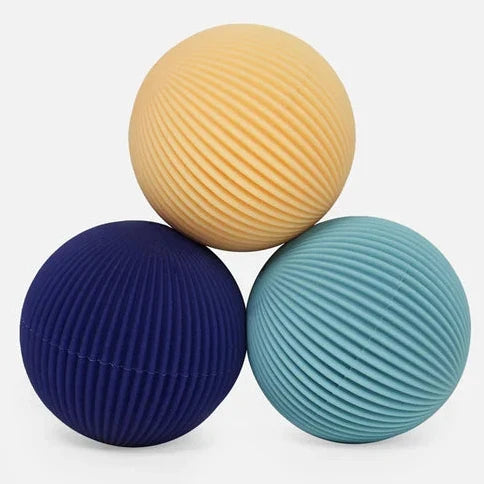 Speks Odds Lines fidget magnets in yellow, navy and teal with ribbed silicone texture