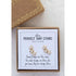 gold plated perfect tiny studs with three stars arranged in a row in an earring box