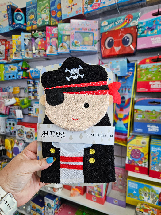 Hand holding Star + Rose pirate cotton bath mitt in a colourful kids bath toy display — Adventure Awaits