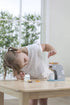 Child playing with PolarB wooden coffee machine play set at table — Adventure Awaits