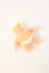 Political caricature stress toy in white briefs lying on plain background — Adventure Awaits
