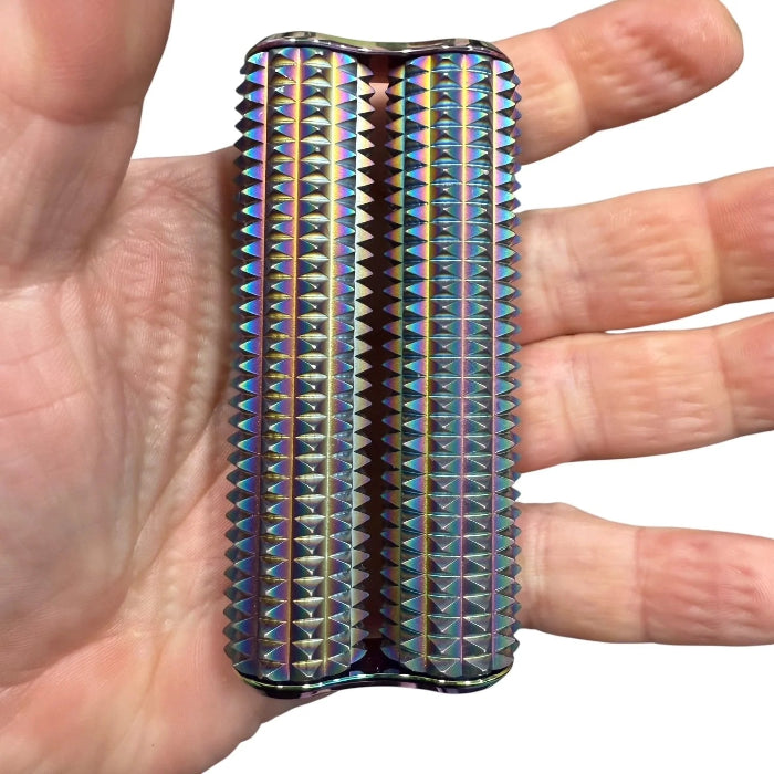 iridescent Kaiko Spikey Hand Roller with dual textured metal rollers displayed in an open palm